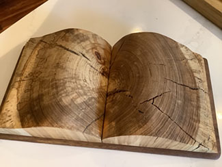 Wooden book carved from hickory